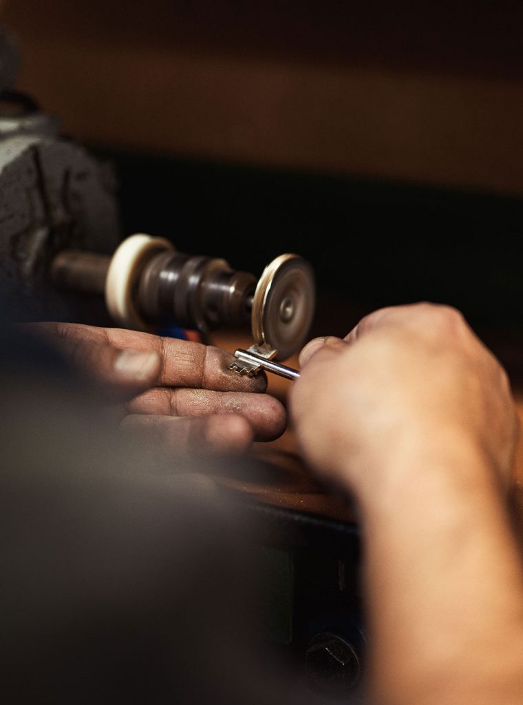 vertical-closeup-shot-of-a-locksmith-s-hands-makin-2023-11-27-05-05-16-utc